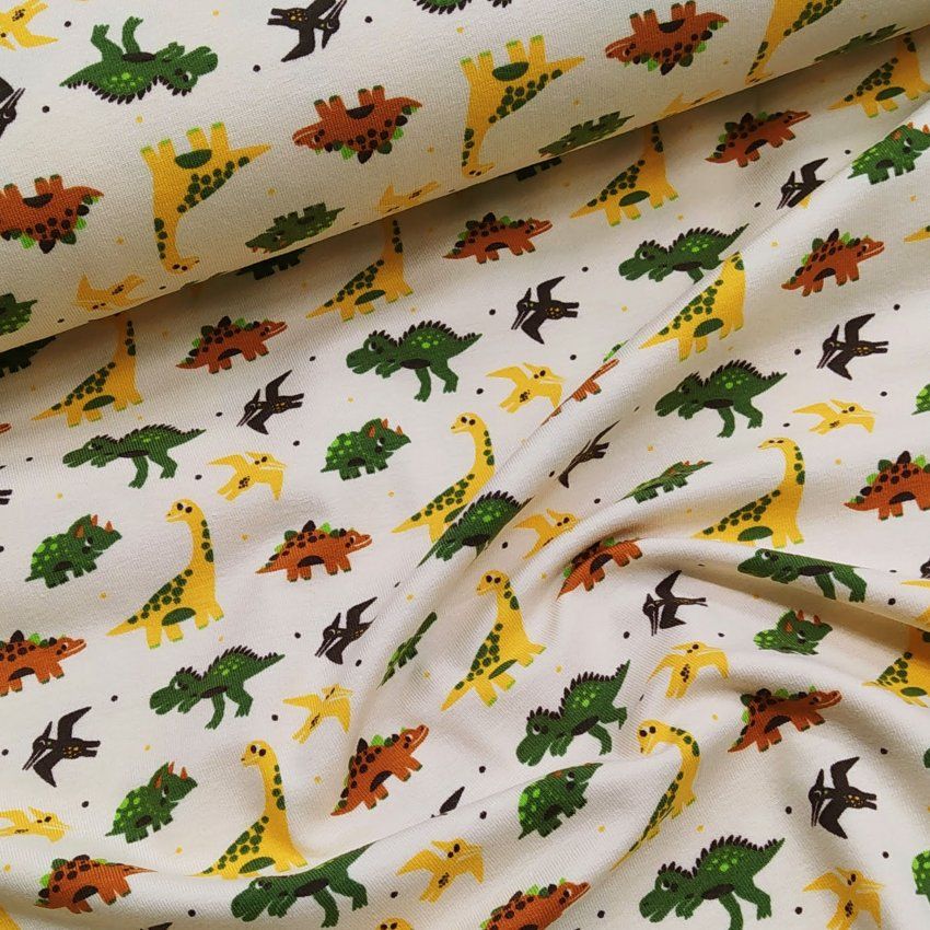 Punto estampado amarillo con dinosaurios
